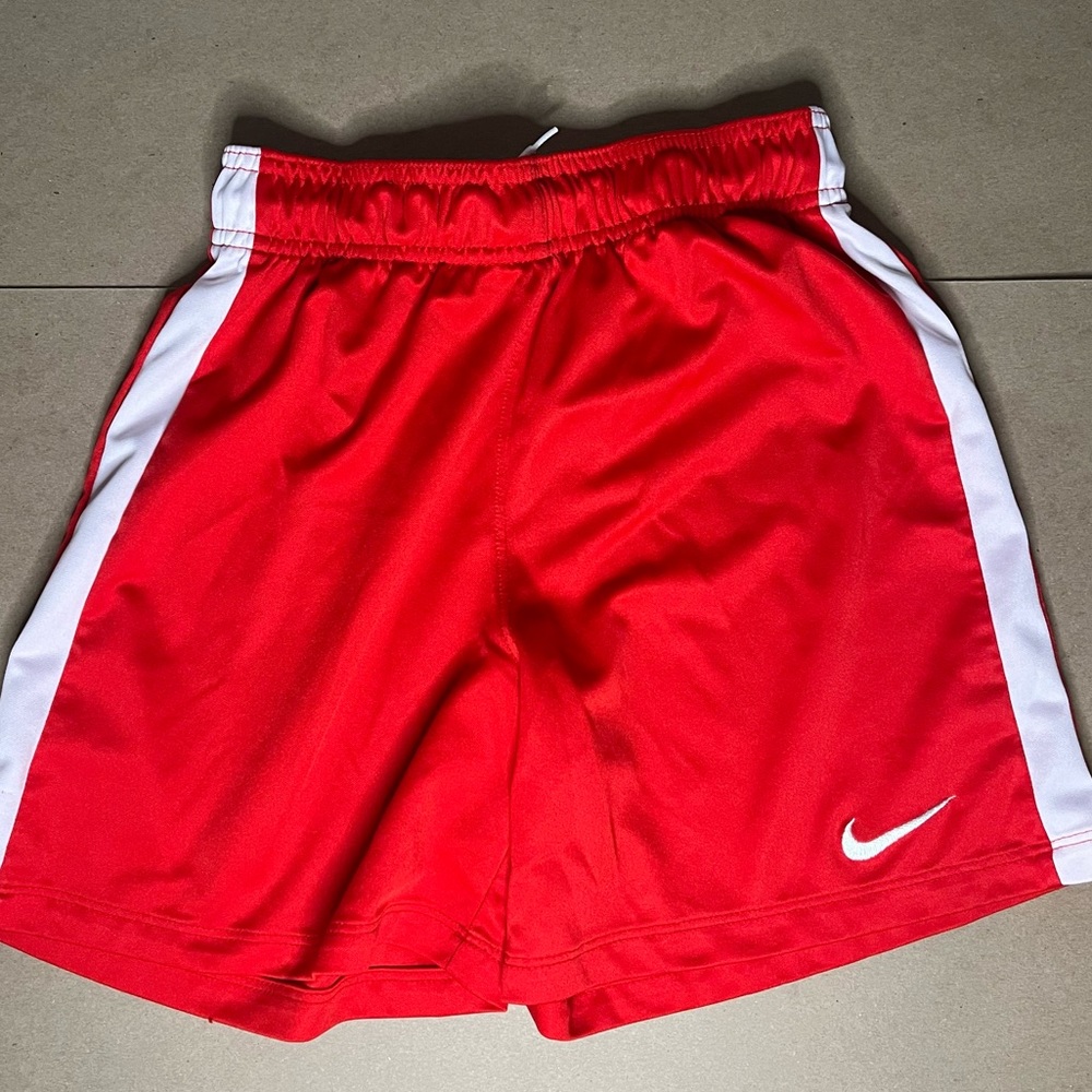 Nike Dry- Fit Red with a White Stripe. Size M(Kids)
